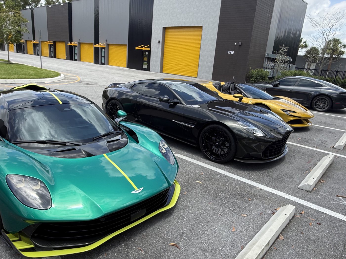 Supercar lineup parked outside the garage